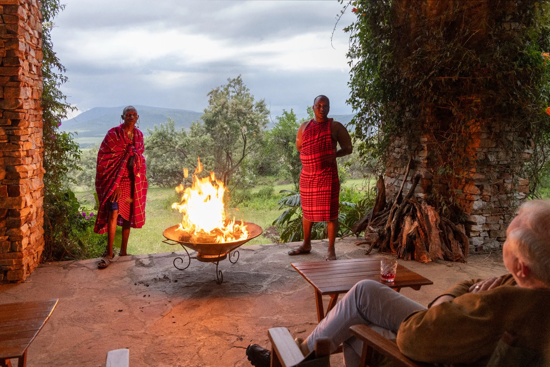 A warm welcome by the fire with our Maasai team